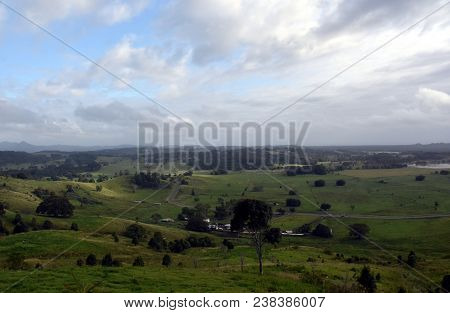 Broad Panorama Of The Countryside In North New South Wales With Green Fields. Grassy Hills In Austra