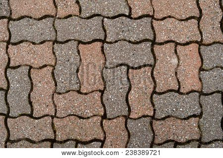 Full Frame Closeup View Of Some Interlocked Flagstone That Has Been Used As A Walkway.