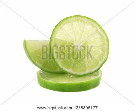 Ripe Slice Of Green Lime Citrus Fruit Isolated On White Background. Lime Wedge With Clipping Path.