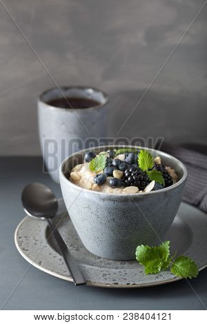 healthy breakfast steel cut oatmeal porridge with blueberry blackberry