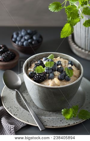 healthy breakfast steel cut oatmeal porridge with blueberry blackberry