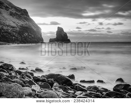 Rocky Coast Of Sea. Slow Shutter Speed For Smooth Water Level. Visite Talisker Bay On The Isle Of Sk