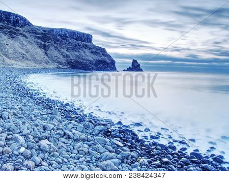 Rocky Coast Of Sea. Slow Shutter Speed For Smooth Water Level. Visite Talisker Bay On The Isle Of Sk