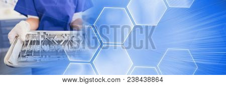 Close up of dentist with trays and blue smart tech transition