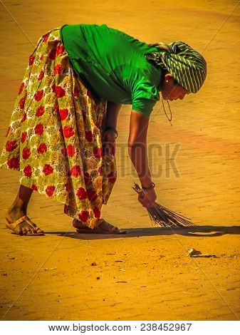 Unknown Woman Cleaning The Street Of Palolem In Goa India October 25-2017 On The Morning