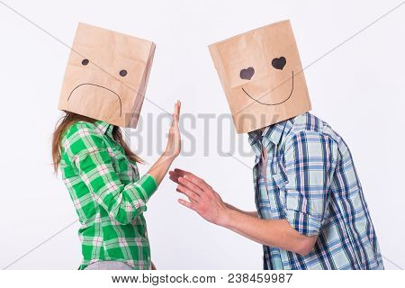 Disappointed Woman With Bags Over Heads Rejecting Her Boyfriend