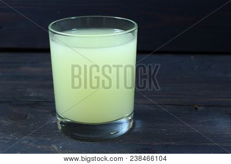 Dairy Whey In A Glass On A Dark Background