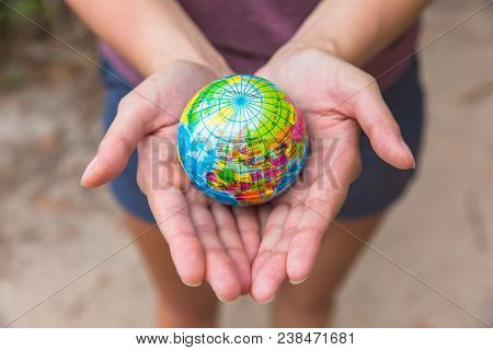 Globe In Hands. The Whole World In Your Hands. Protect The World From War And Disaster.