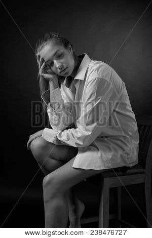 Young Pretty Woman In White Shirt . Beautiful Girl Onblack Background.