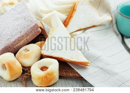 Many Kinds Of Bread On Wooden Boards.