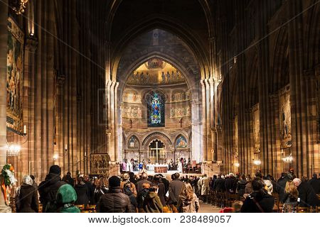 Strasbourg, France - December 11, 2011: People On Night Church Service In The Cathedral Of Notre Dam