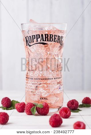 London, Uk - April 27, 2018: Cold Glass Of Kopparberg Premium Raspberry Cider  On White Background.