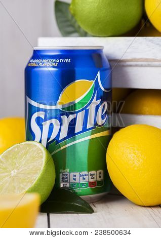 London, Uk - April 12, 2017: Aluminium Can Of Sprite Drink On Wooden Background With Lemons And Lime