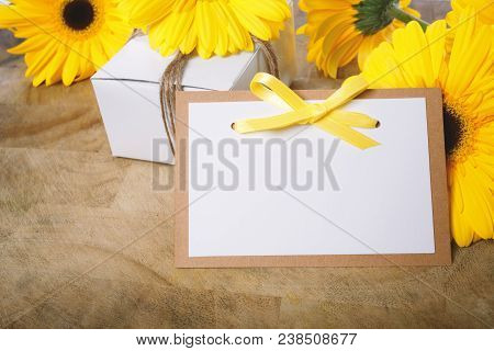 Little Gift Box With With Yellow Flowers In A Rustic Style
