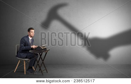 Shadow threatening hard worker man who is afraid