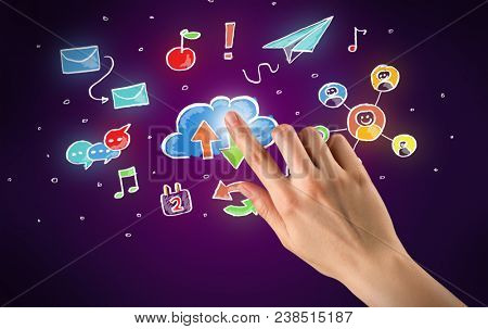 Female hand toucing mixed media icons with purple background
