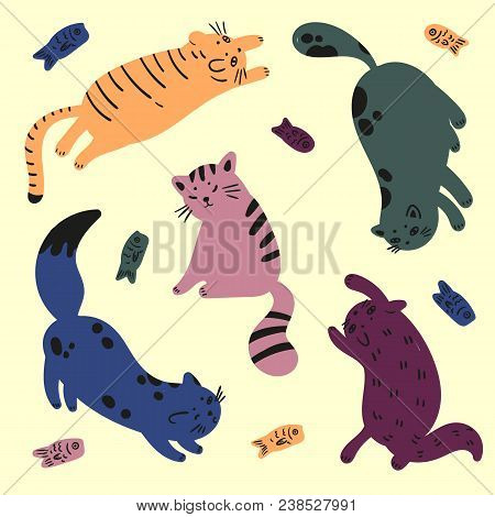 Colorful Cats Are Playing With Fish. Catfood And Household Pet Animals. Lovely And Funny Kittens Are