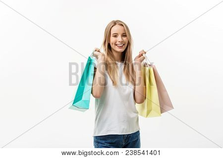 Shopping And Lifestyle Concept: Young Happy Summer Shopping Woman Smiling And Holding Shopping Bags 