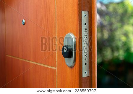 Open Door Of A Family Home. Close-up Of The Lock An Armored Door.
