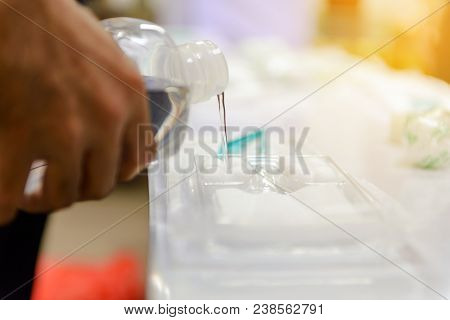 Pouring Normal Saline Into Medical Nursing Set