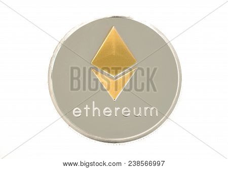 Single Real Coin Of Cryptocurrency Silver And Golden Ethereum Isolated On White Background