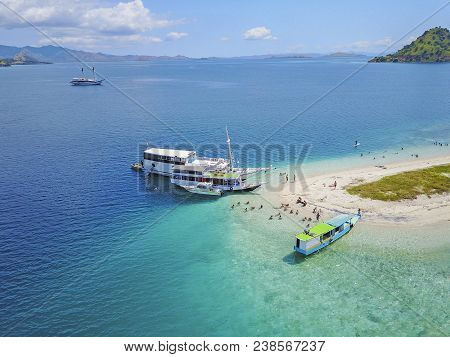 Beautiful Aerial View Of Beaches And Tourist Boat Sailing In Flores Island, Indonesia.