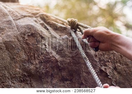 Men Climbing On Rock Outdoor, Close-up Image Of Climber Hand