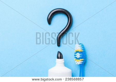 Black Toothpaste From Charcoal For White Teeth. Tooth-paste In The Form Of  Question Mark, Tube And 