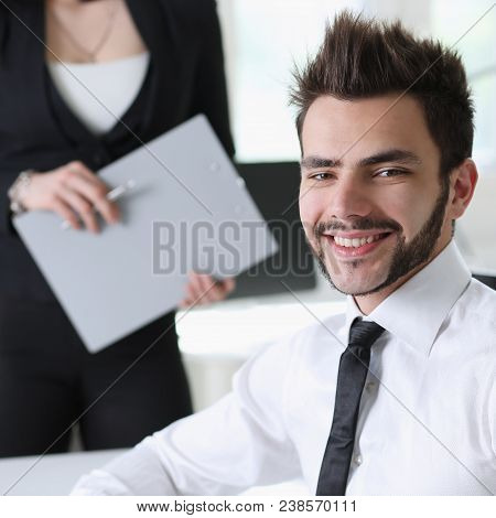 Portrait Of  Handsome Man Work At Office With Assistant