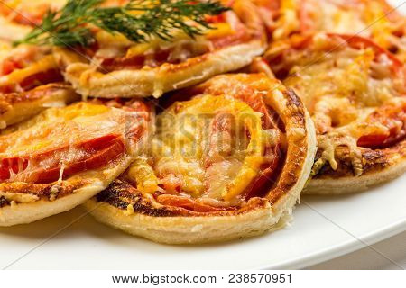 Mix Of Mini Pizzas On A Stone Try On White Background