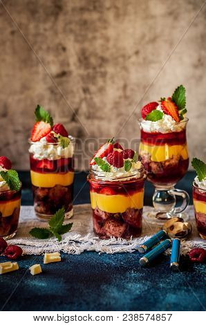 Fruit Cake, Jelly, Custard, Berry And White Cocolate Whipped Cream Individual Trifles, Copy Space Fo
