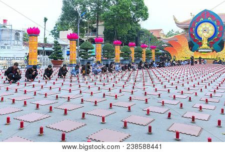 Ho Chi Minh City, Vietnam - January 3, 2018: Buddhist Party Came Prepared With Hundreds Candles Line