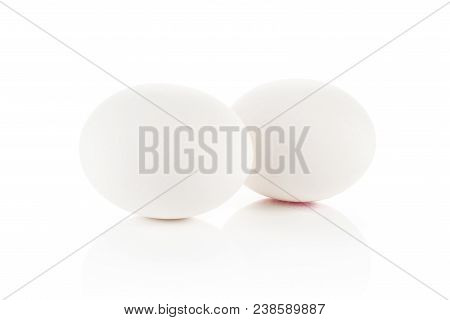 Two White Chicken Eggs Isolated On White Background