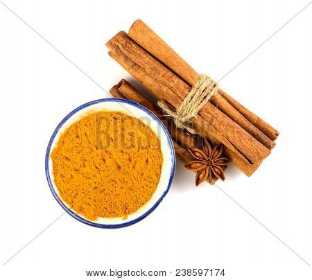 Close Up The Brown Cinnamon Stick And Powder With Star Anise Spice  Isolated On White Background
