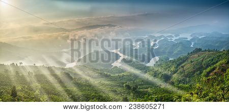 Ta Dung Lake In The Morning When Sun Rays At The Top Of The Mountain Shines Fog Into The Lake Full O
