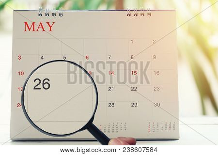 Magnifying Glass In Hand On Calendar You Can Look Twenty-six Day Of Month,focus Number Twenty-six In