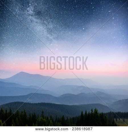 Dairy  In The Woods. Dramatic And Picturesque Scene. Fantastic Starry Sky And The Milky Way