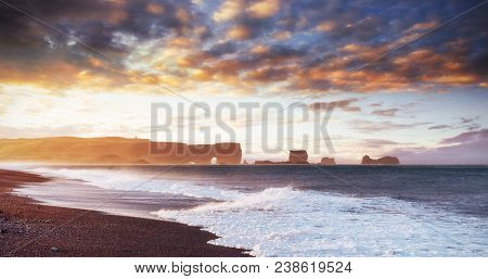 Famous Reynisdrangar Rock Formations At Black Reynisfjara Beach. Coast Of The Atlantic Ocean Near Vi