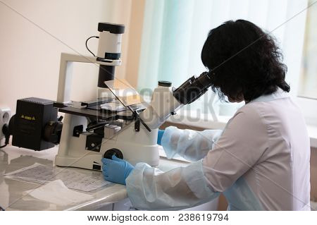 Belarus, Gomel, 24 April 2018. Blood Transfusion Station.a Lab Assistant Looks Through A Microscope