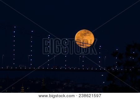 Super Blue Blood Moon Behind Bosphorus Bridge In Istanbul City, Turkey