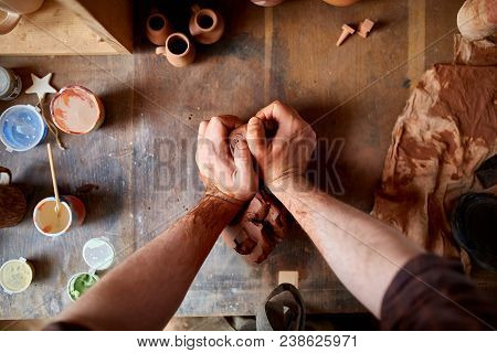 Male Potter Molding A Clay In Pottery Workshop, Close-up, Selective Focus.