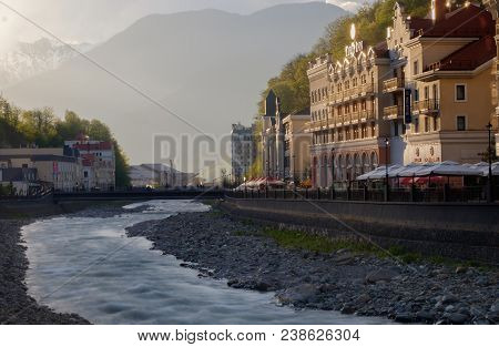 Rosa Khutor, Russia - April 22, 2018: View On Tulip Inn Hotel From The Opposite Side Of The River. S