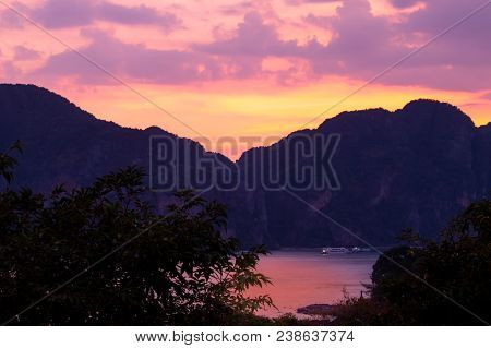 A Golden Hour Sunset Over The Mountains At Koh Phi Phi Don Island Along The Andaman Cost Of Thailand