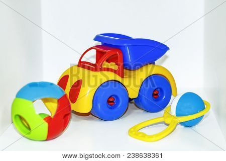 Children's Toys: Rattle, Teetotal And Plastic Truck