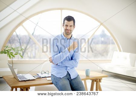Smiling Young Businessman In The Office