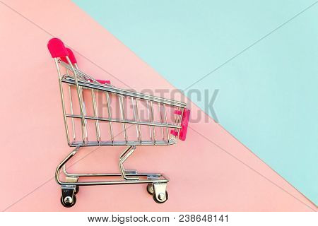 Small Supermarket Grocery Push Cart For Shopping Toy With Wheels And Pink Plastic Elements On Pink A