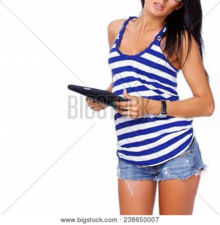 Portrait Of Sexy Brunet Posing In Studio With Ipad
