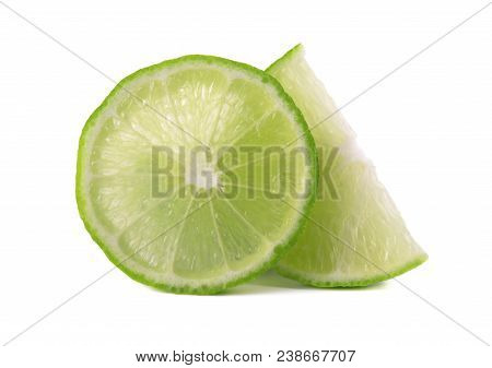 Ripe Slice Of Green Lime Citrus Fruit Isolated On White Background. Lime Wedge With Clipping Path.