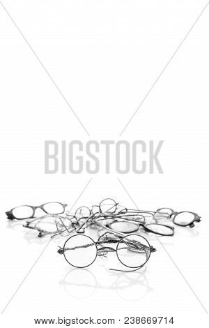 Group Of Old Broken Eyeglasses Isolated On White Background. Move For Create Place For Text. Concept