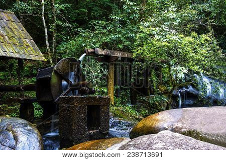 Waterfall With Green Forest And Water Turbine At  Pu Hin Rong Kla Naiton Prk ,phitsanu Lok Province 